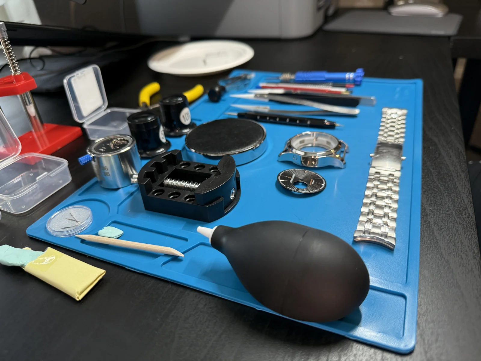Watchmaking parts and tools on the workbench